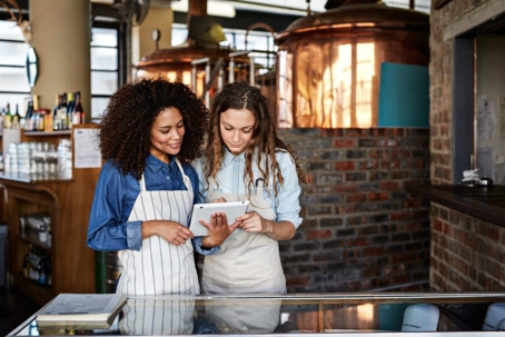 woman looking over a tablet
