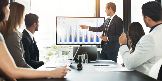 employer and employees at business meeting