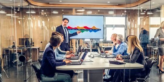 workers in office meeting room