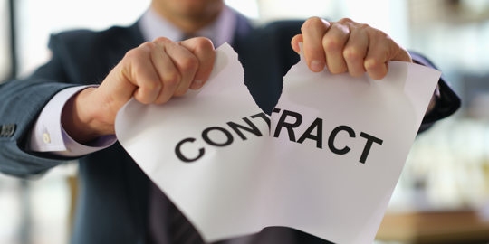 Man ripping "Contract" in half