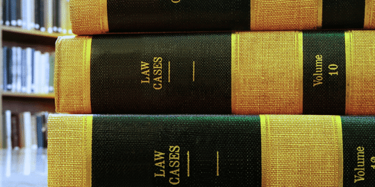 Law Textbooks stacked in a library