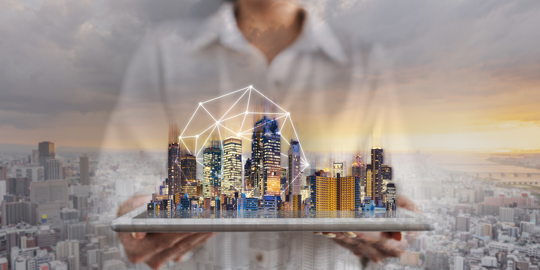 person holding city on tablet