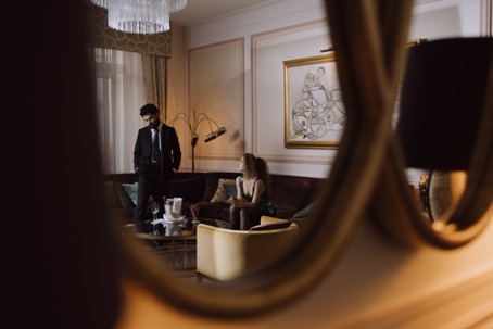 man & woman reflection in mirror
