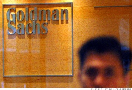 man standing in front of business sign