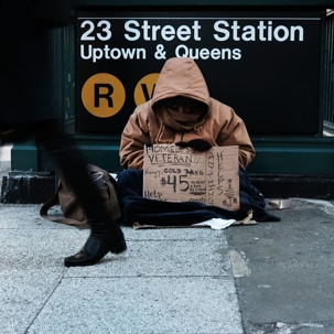 man with homeless sign