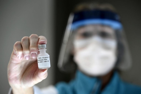 holding vile of medication